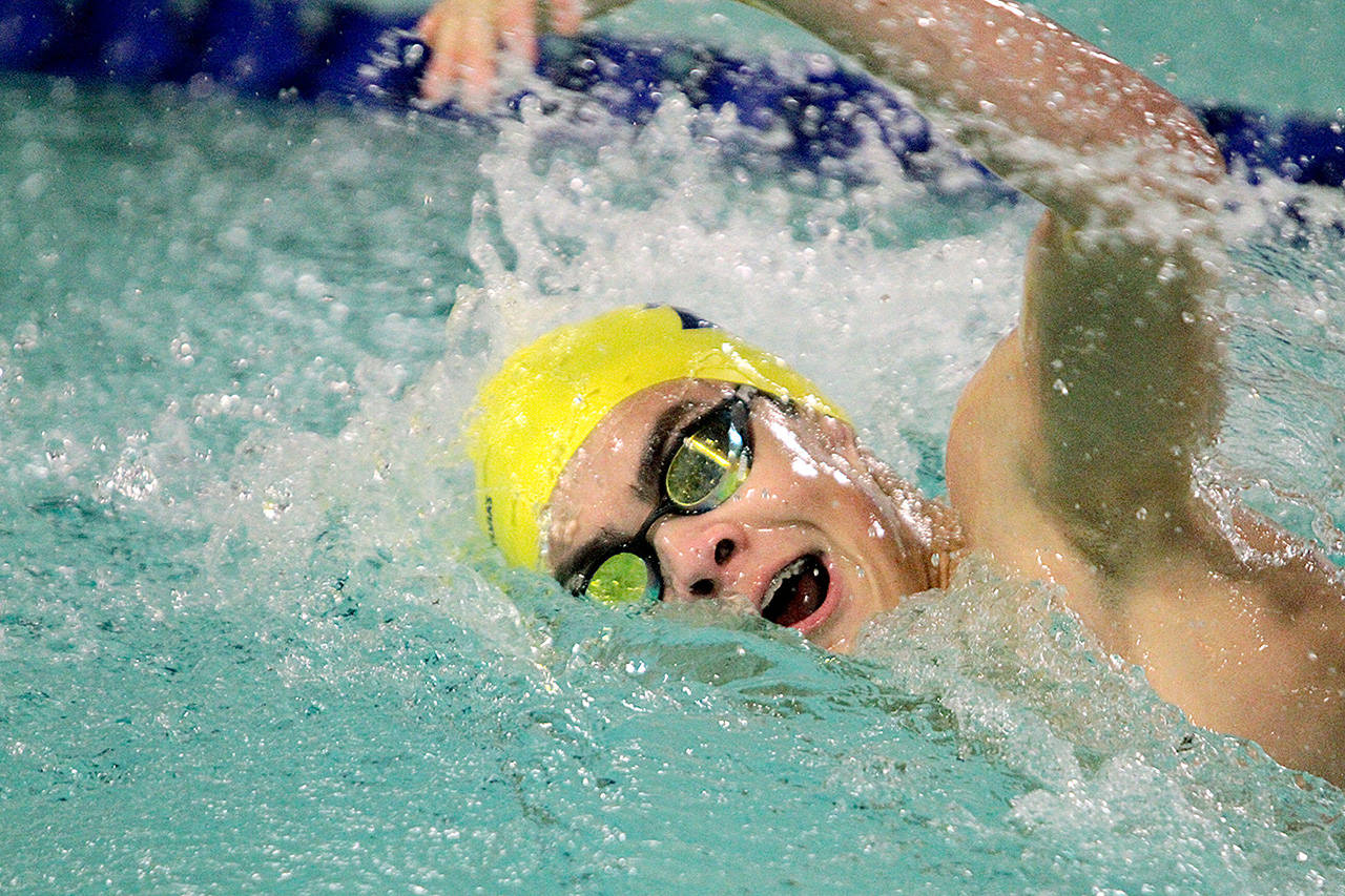 Bainbridge’s Colin McDevitt races to a second-place finish in the 200-yard freestyle in last week’s meet against Eastside Catholic. (Brian Kelly | Bainbridge Island Review)