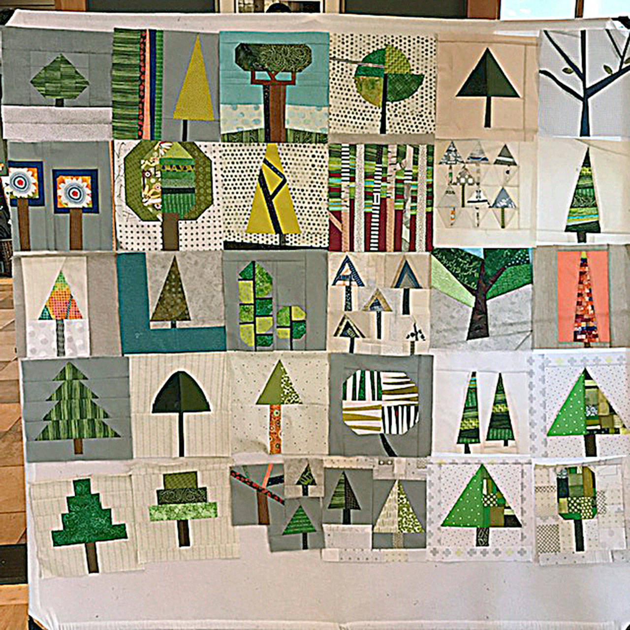 Photo courtesy of Kathy Ruwe | As part of an international group effort by many similar clubs and guilds, the Bainbridge Island Modern Quilt Guild has spent the past weeks assembling blocks (the squares that make up a quilt) to be sent to Australia and assembled into quilts, which will then be given to those who have been displaced by the fires.