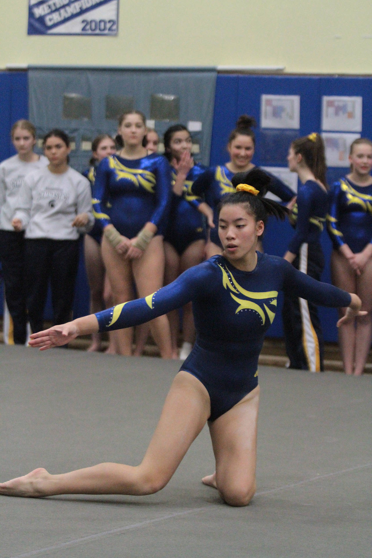 Katharine Cooper, shown here competing on floor during the Senior Night meet at Bainbridge High, has qualified for the state 3A championships. (Brian Kelly | Bainbridge Island Review)