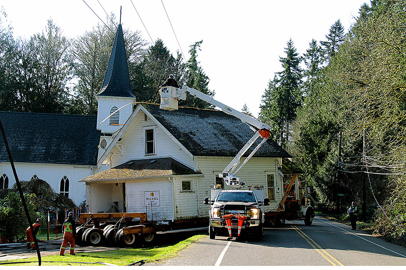 Home, home on the road: Church’s old parsonage trucked to new location