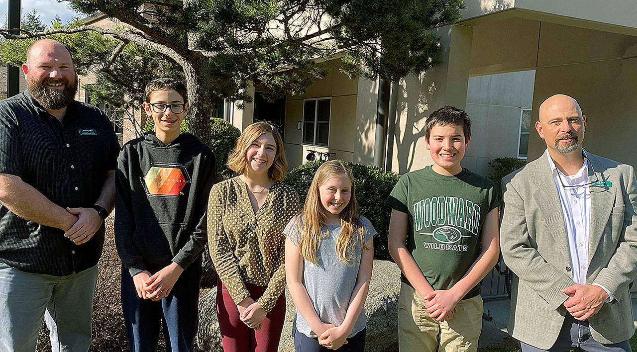 Woodward Middle School Associate Principal Travis Tebo stands with Student of the Month winners Milo McIntosh, Evelyn Cantwell, Katherine Walker, and Joseph Tappen, and WMS Principal Jeff Hale. (Photo courtesy of Woodward Middle School)