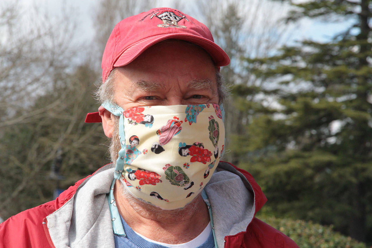 Homemade medical masks have become ubiquitous on Bainbridge Island over the past week, and there have been plenty of colorful and creative ones, like this one, worn by a Bainbridge resident who stopped by city hall to donate items for the city’s personal protective equipment drive earlier this week. He declined to give his name, but said he could be identified as one of the most handsome men on Bainbridge. (Brian Kelly | Bainbridge Island Review)