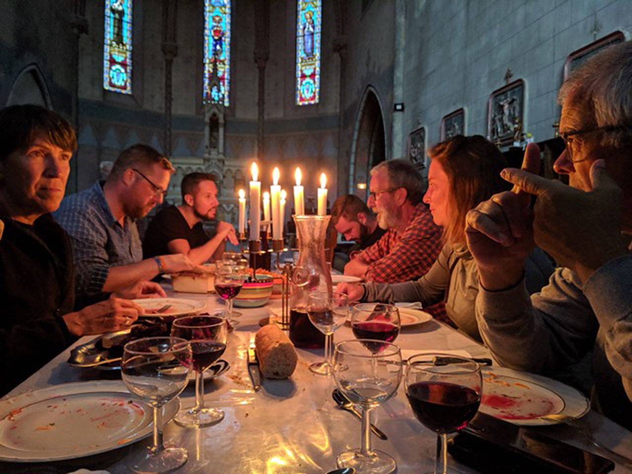 Carla Mackey photo | Pilgrims enjoy a meal in a converted cathedral.