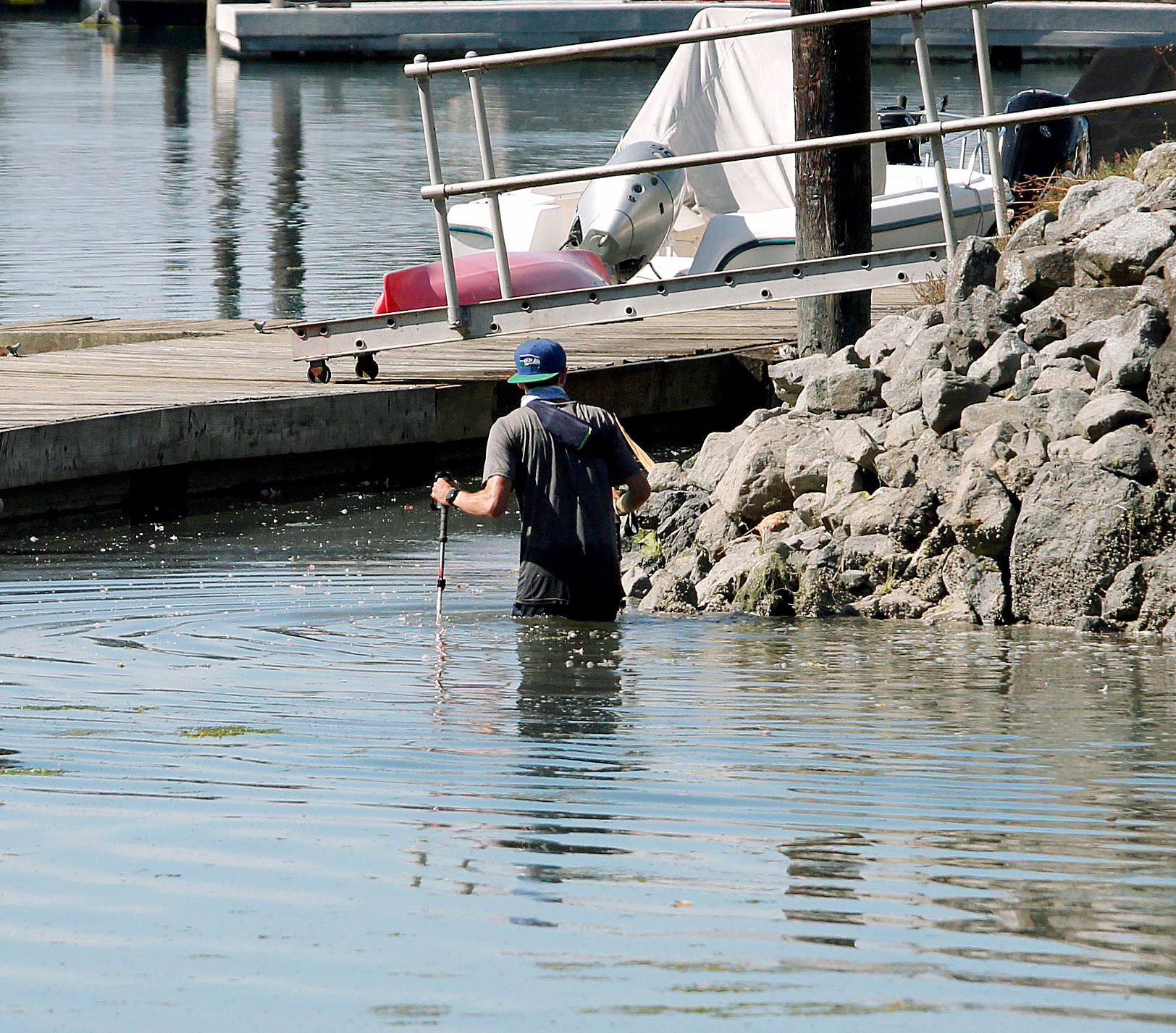 <em>Nance attempts to navigate waist deep water near Point Monroe.</em> Mark Krulish/Kitsap News Group