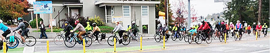 Bicyclists pedal along Winslow Way.