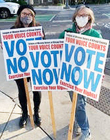League of Women Voters - Kitsap members Cynthia Shick and Alicia Vause encourage people to vote. Courtesy photo