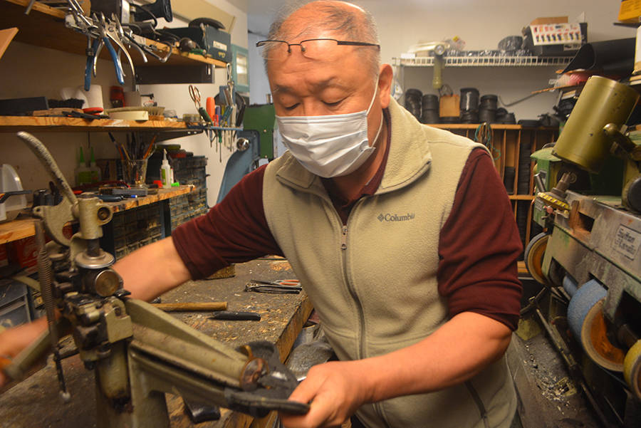 Chum Cho works in his shoe repair store. Steve Powell/Bainbridge Island Review photos