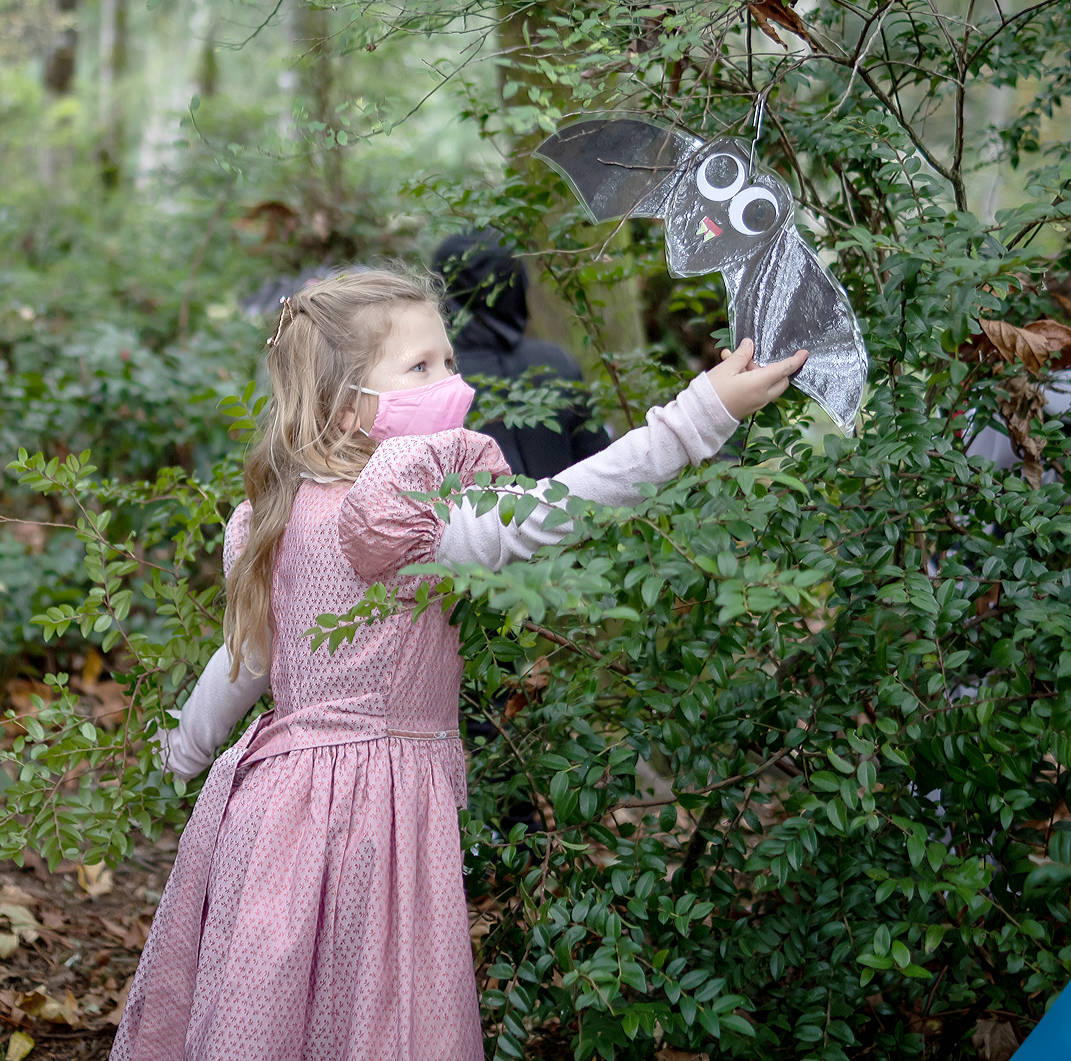 Olivia Karsten, 6, finds Halloween art in the forest. Cameron Karsten/Courtesy photo