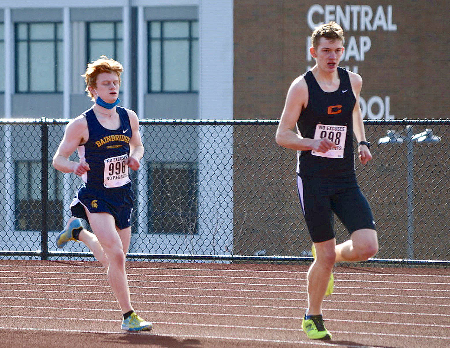Bainbridge’s Alex Miller chases down Central Kitsap’s Daniel Lizon in the second Olympic League meet of the season. Miller won the race with a time of 17:20.20. (Photo courtesy of Rick Peters)