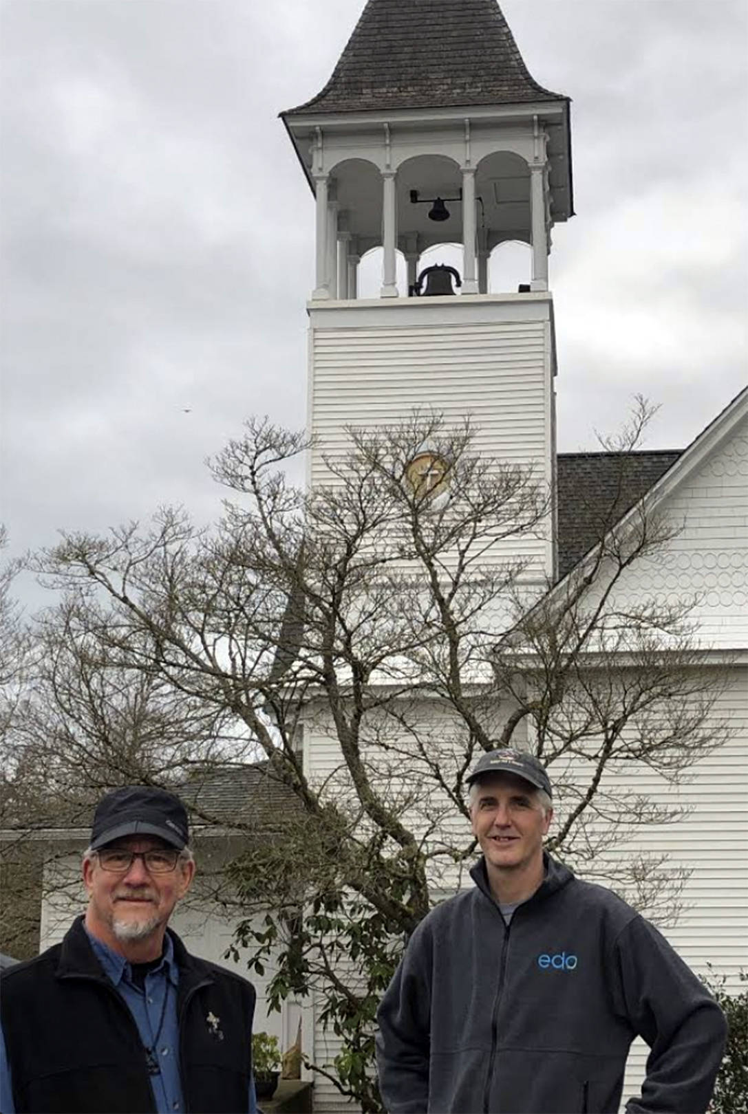 Jim MacphersonJ and David Beemer in front of the large church bell. Courtesy photo