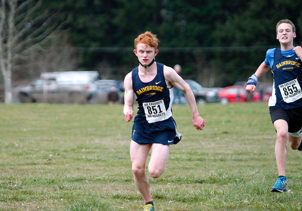 Bainbridge junior Alex Miller finished second for the boys, followed closely by freshman Bodie Strom (right). (Mark Krulish/Kitsap News Group)