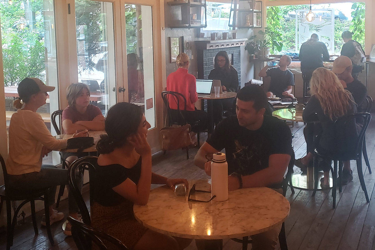 Customers sit inside Pegasus Coffee House Wednesday. Tyler Shuey/Bainbridge Island Review