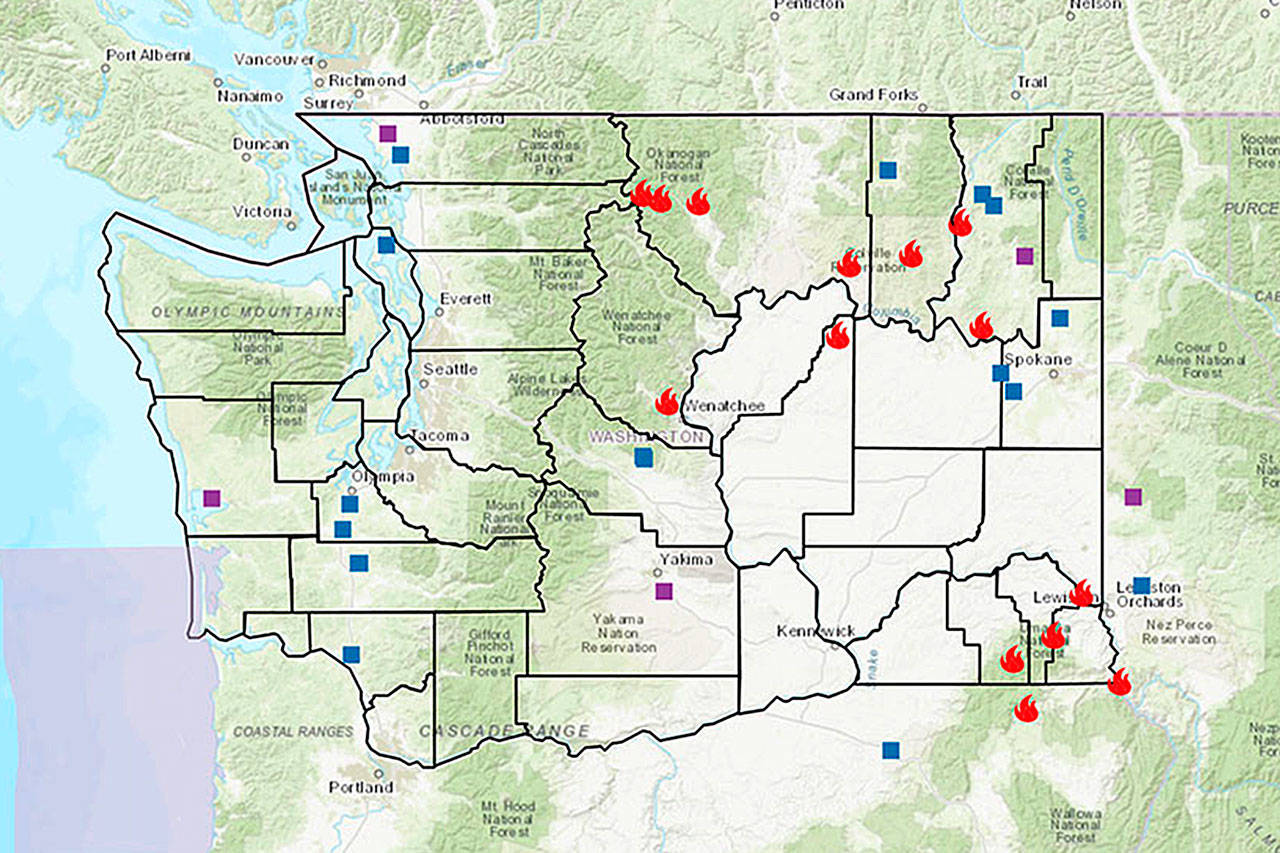 A map provided by the state Department of Natural Resources shows fires currently burning across Washington state. The red flame symbol represents a large fire, the blue squares represent a fire that started in the past 24 hours and the purple squares represent a fire that has been burning between 24 and 48 hours. (DNR map)