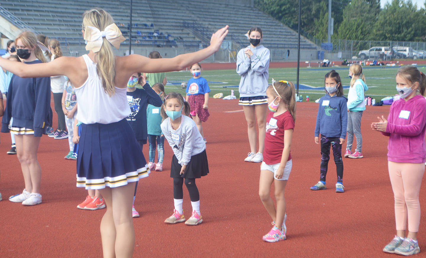 Young campers look a little confused as BHS varsity cheerleaders perform the beginning of the routine.