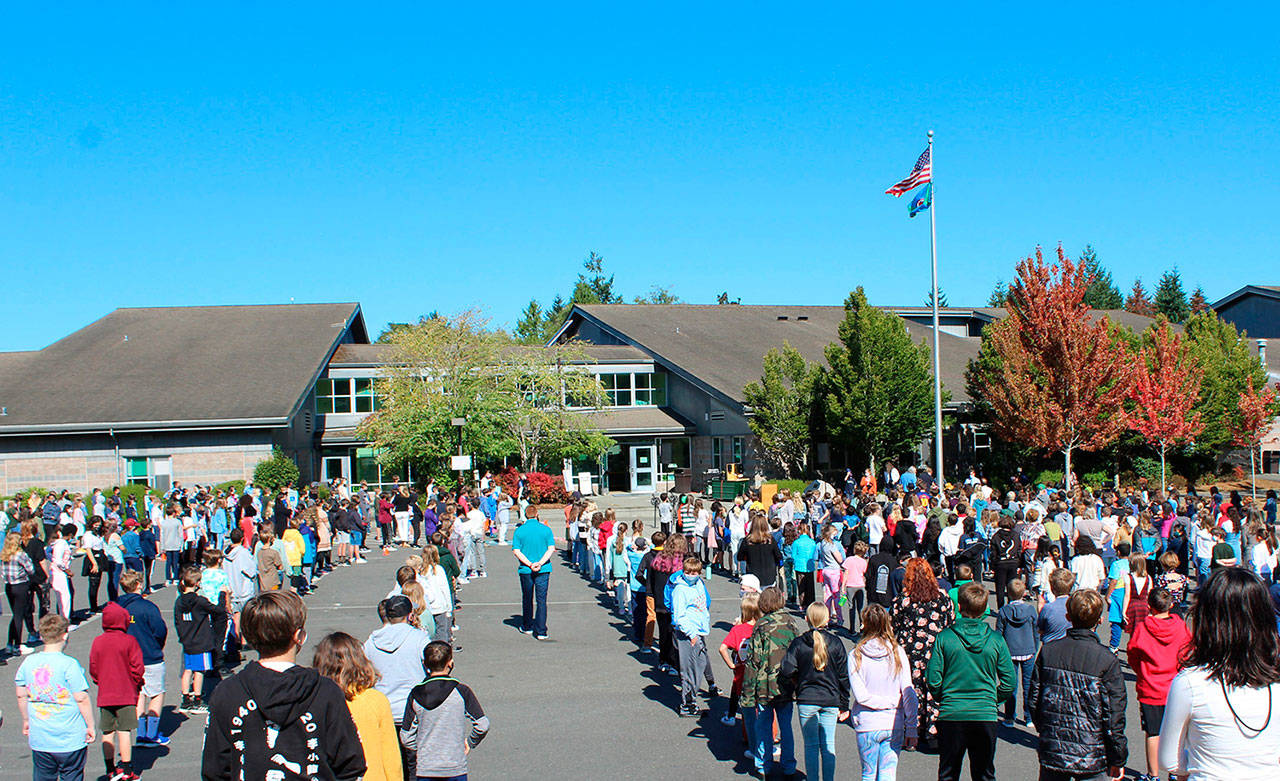 Students at Sakai Middle School line up before entering the building on the first day of school. Courtesy photo