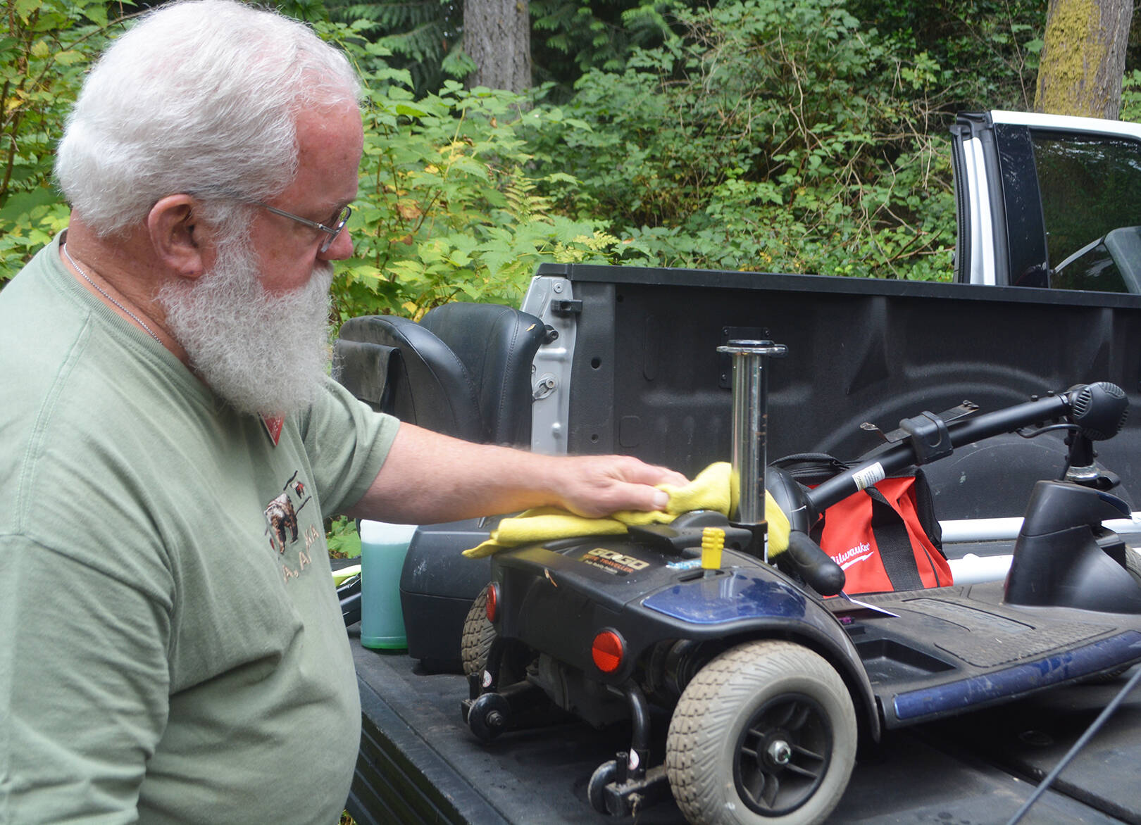 After returning some loaned items back to BI, Mike Slavin cleans up some equipment to take to the Bremerton area to other people who need to borrow it.