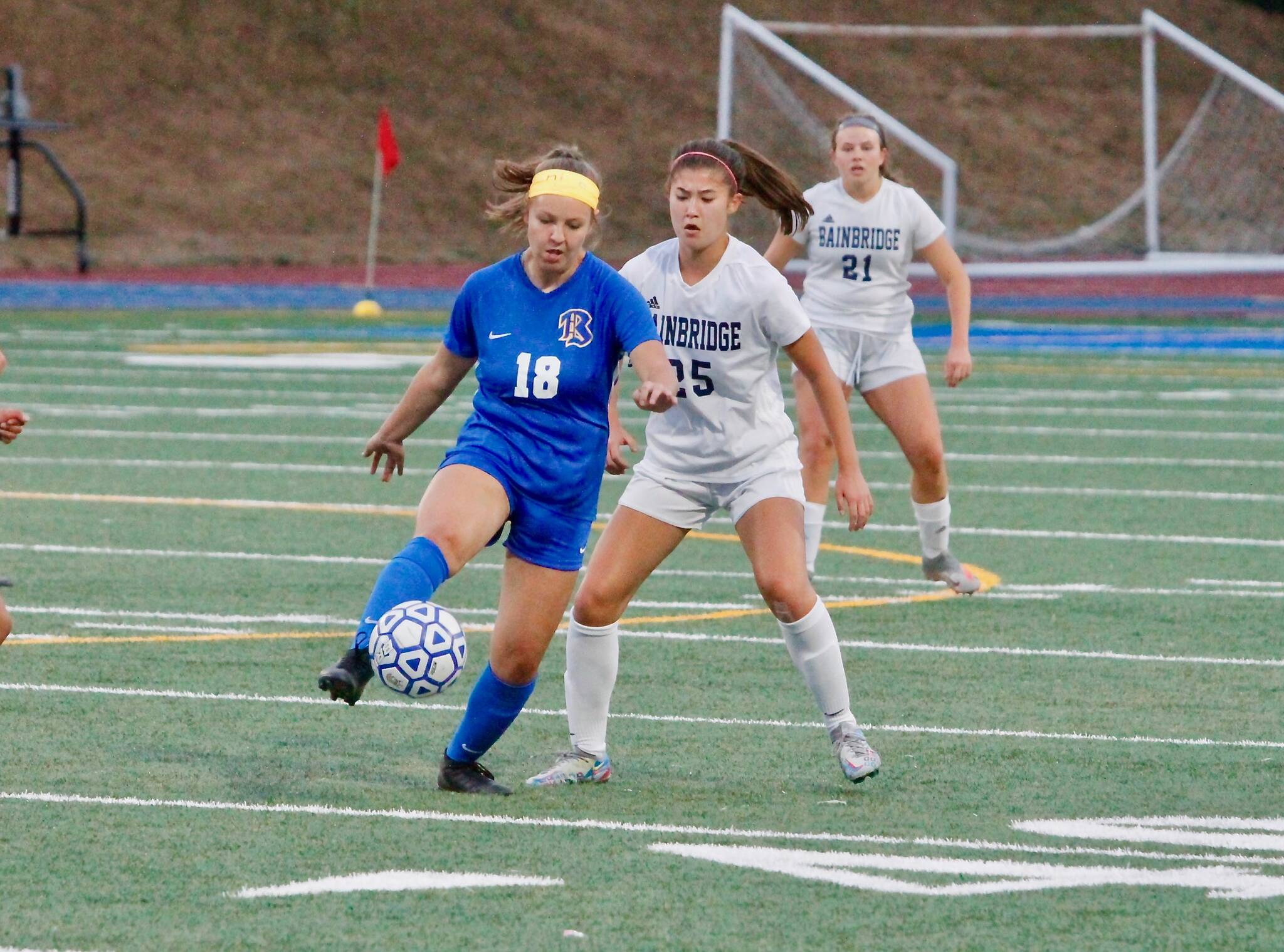 Hailey Fink looks for a way to get the ball from Bremerton’s Alexis Hooley.