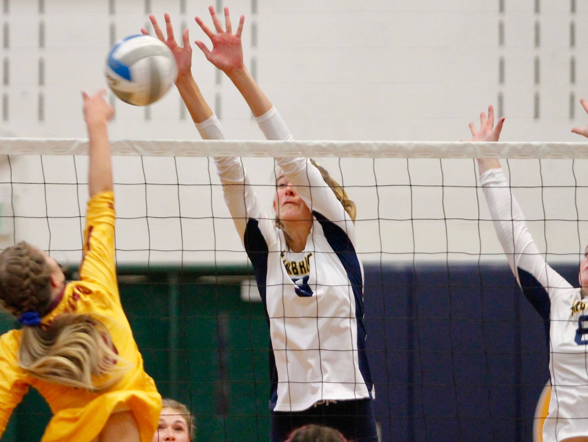 Bainbridge middle blocker Holley McFadden gets in the way of a Kingston shot during her team’s victory over the Bucs on Thursday. (Mark Krulish/Kitsap News Group)