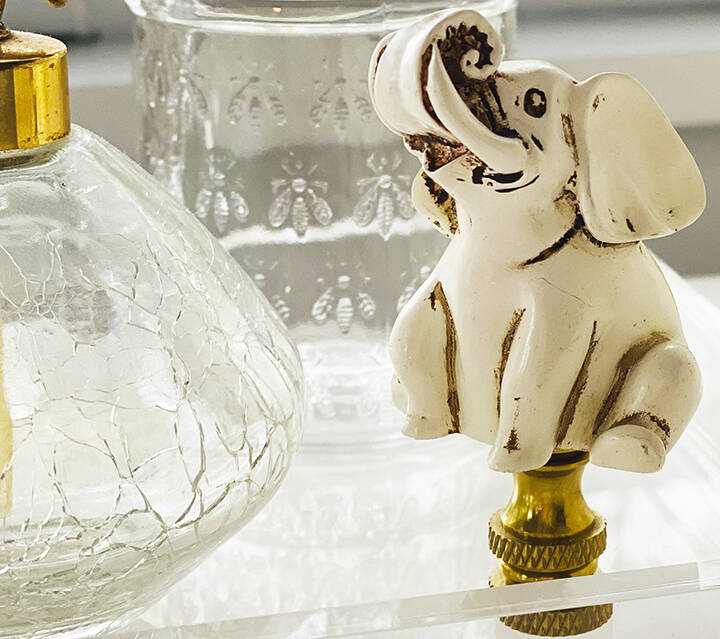 Ivory lamp finial depicting an elephant that was tossed is now a decorative figurine.