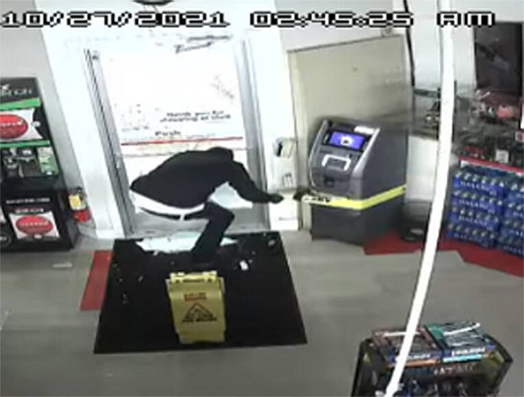 Screen shot from video shows man trying to steal the ATM. Courtesy Photo
