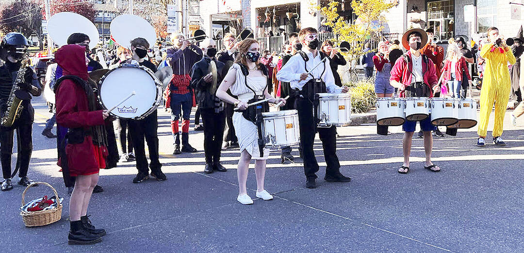 The Bainbridge High band performs in costume on Winslow Way. Nancy Treder/Bainbridge Island Review photos