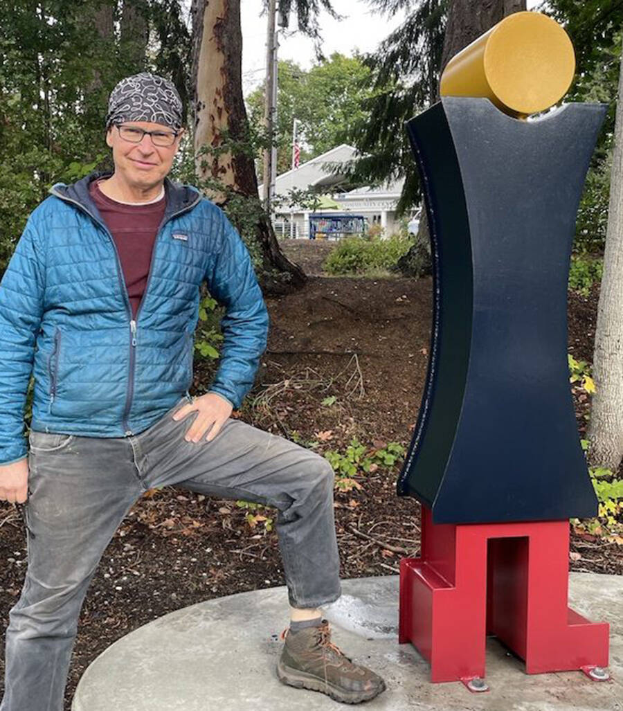 Ed McCarthy with his sculpture. Courtesy Photo