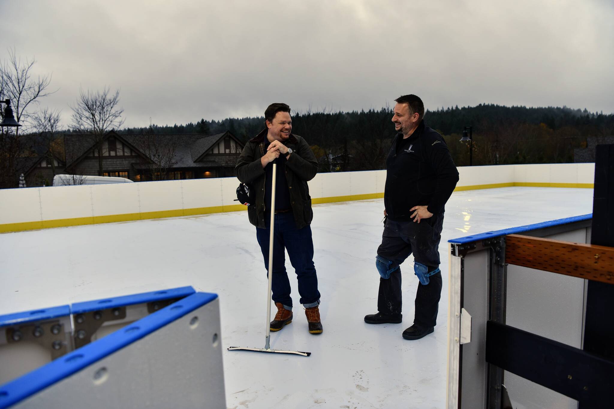 Pleasant Beach Village general manager Joe Raymond and Josh Sluys, director of facilities, making the final checks on the new skating rink before it opened to the public Nov. 26. The new facility is a synthetic ice skating rink that will be open through the winter months.