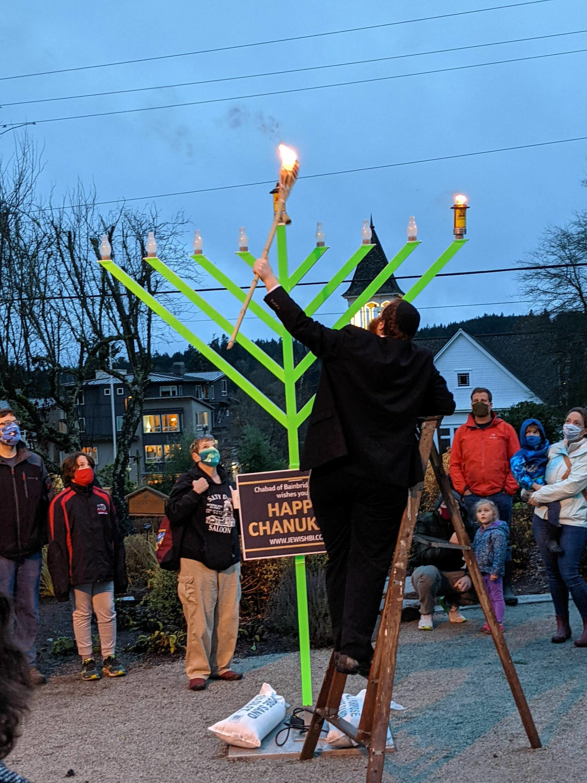 Rabbi Mendi Goldshmid, co-director of the Chabad Jewish Center of Bainbridge Island & North Kitsap, lit the first candle of the community Menorah in observance of the first night of Hanukkah.