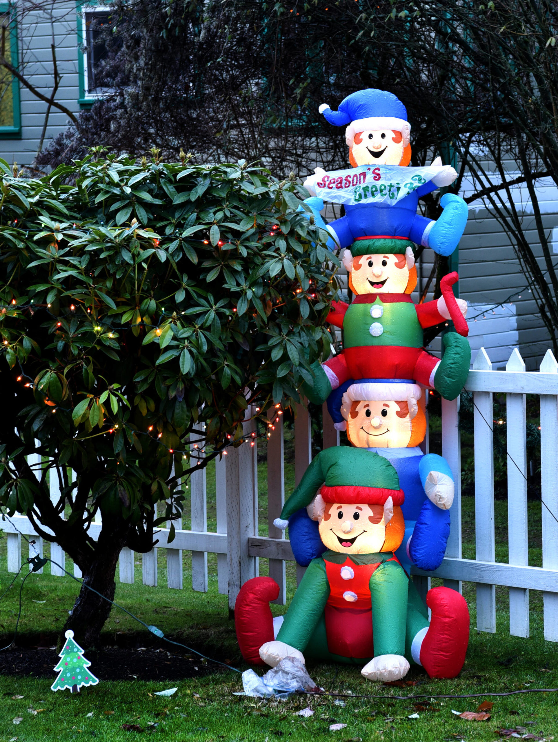 Elves playing in Jackie West's yard on Ferncliff Avenue.