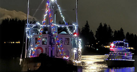 An impromptu holiday boat parade took place on Eagle Harbor off Bainbridge Island under a full moon Sunday night. The boats with Christmas lights lit up the waters. Washington State Ferries and the city of Seattle lit up at night added to the joy of the evening. Jonathan Davis Courtesy Photos