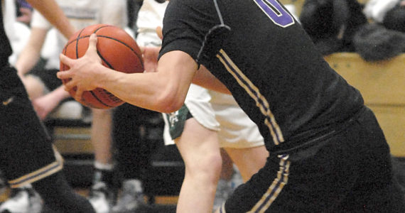 North Kitsap’s Johny Olmsted (0) gets the Viking fastbreak started against Port Angeles Thursday night. PA, however, was able to slow down NK to get the win. Keith Thorpe/For the Herald