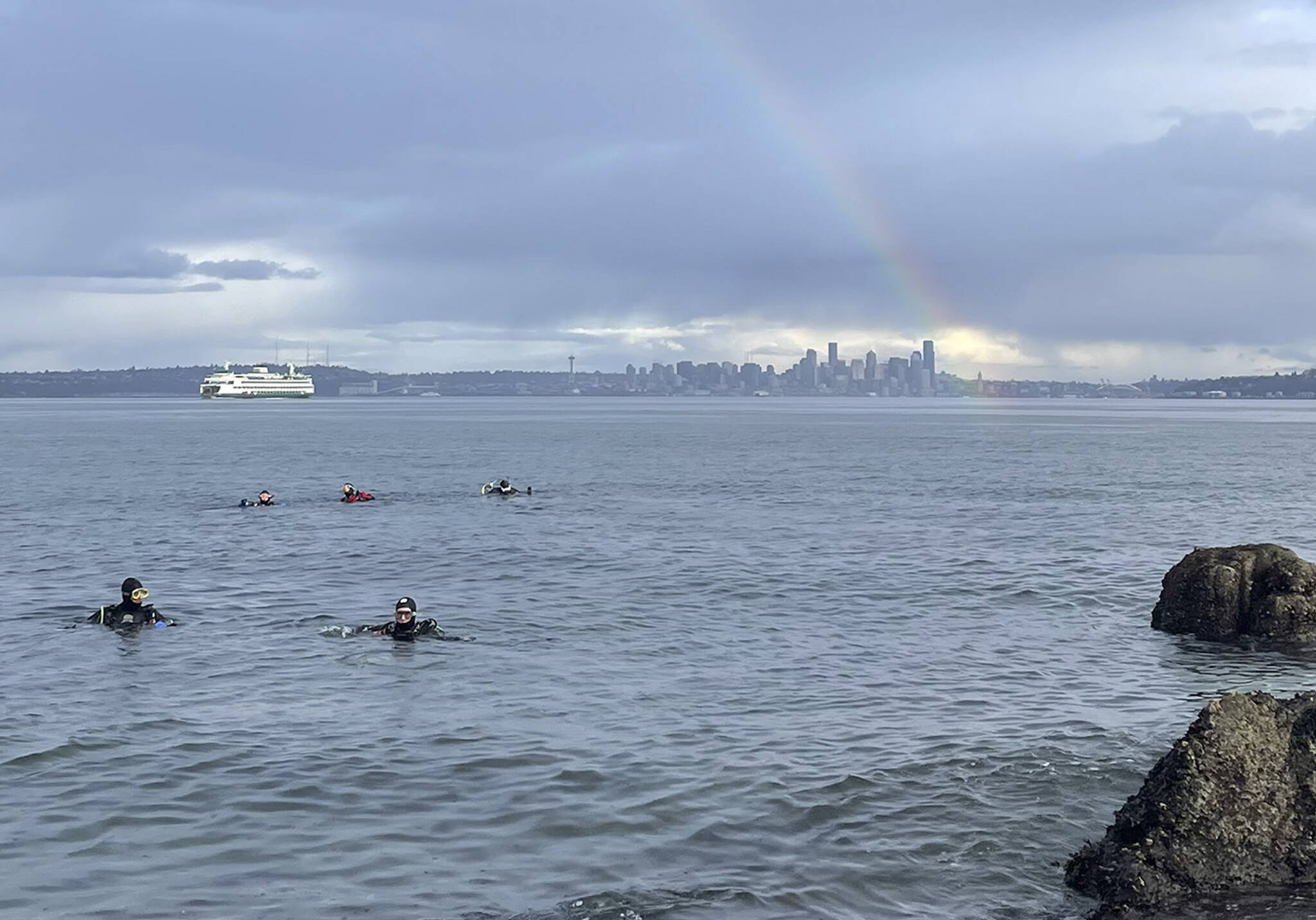 Somewhere under the rainbow waters are blue - and inhabited not only by a Washington State Ferries vessel, but also a group of scuba divers. This photo was submitted by Matthew Freniere of divers off Rockaway Beach.