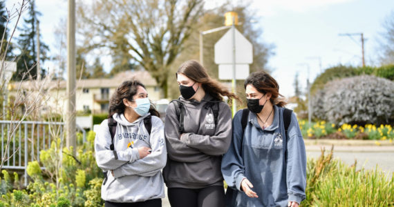 BHS juniors Olivia O’Rourke, Rain Malzahn and Laura Carrillo walk to lunch Tuesday. They are adjusting to the change by wearing or removing their masks as they feel comfortable.