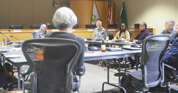 Council members and some city department heads sit in a circle during the retreat. Steve Powell/Bainbridge Review photos