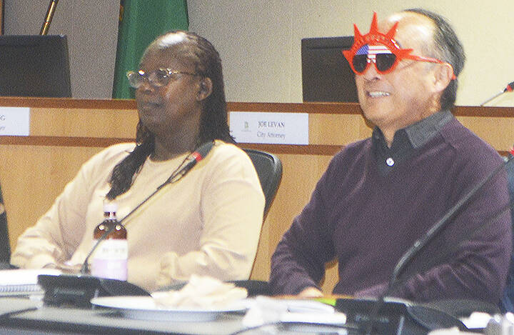 Clarence Moriwaki put on some funny red glasses that were passed around at the retreat to show that humor is needed.