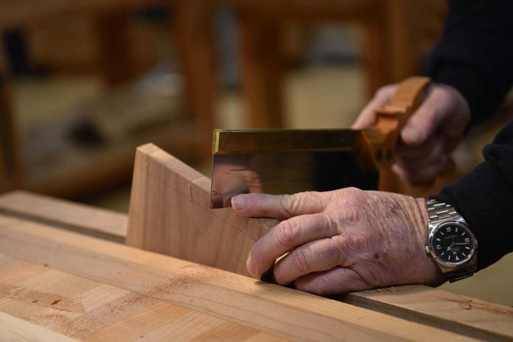 Paul Kury making dovetail cuts for a wooden box.