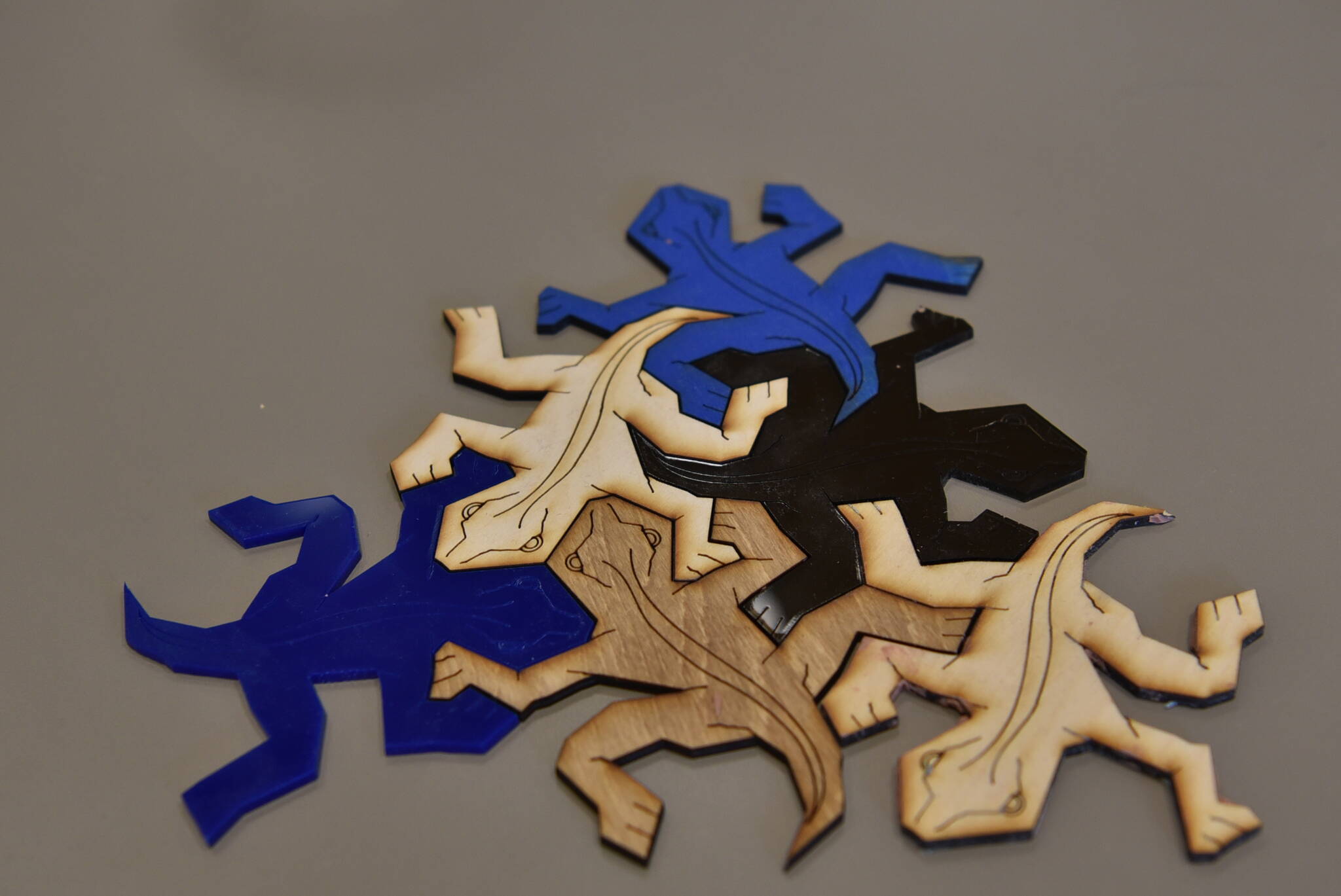 Lasercut puzzle pieces made in the Electronic & Technical Arts studio.