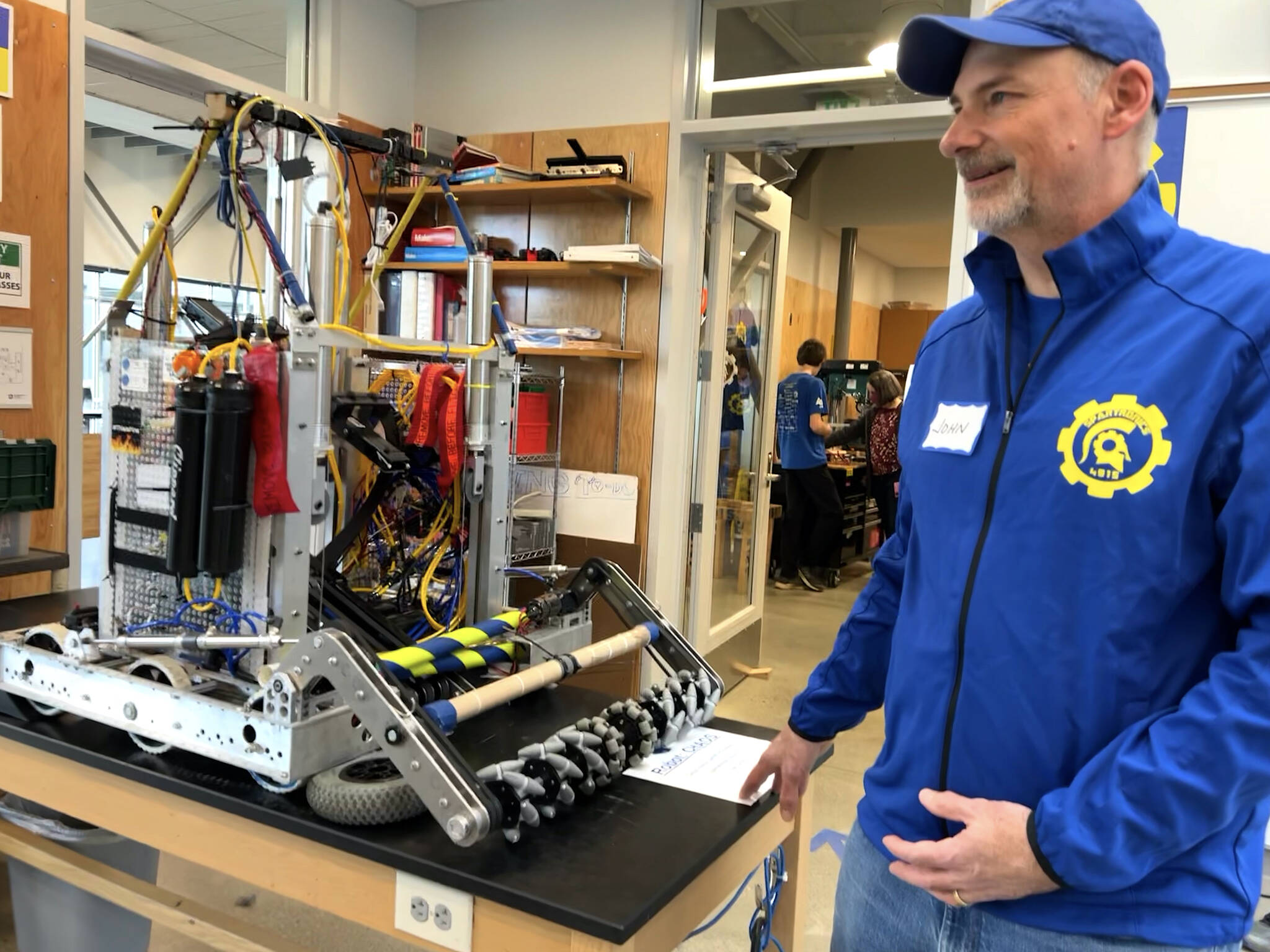 Professional mentor John Sachs introduces attendees to CHAOS, a robot built in 2019.