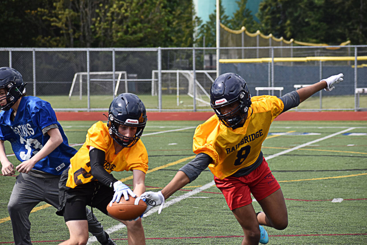 Bainbridge High School football captain Micah Bryant practices defensive drills during spring football practice.