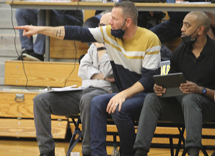 Coach Steve Haizlip points out something to his assistant coaches in a game last year.