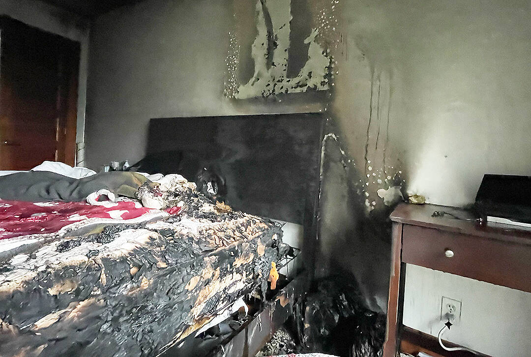 A vape pen, left charging on the nightstand at right, is thought to have sparked a fire when the device apparently failed and ignited nearby papers and bedding. Courtesy Photo