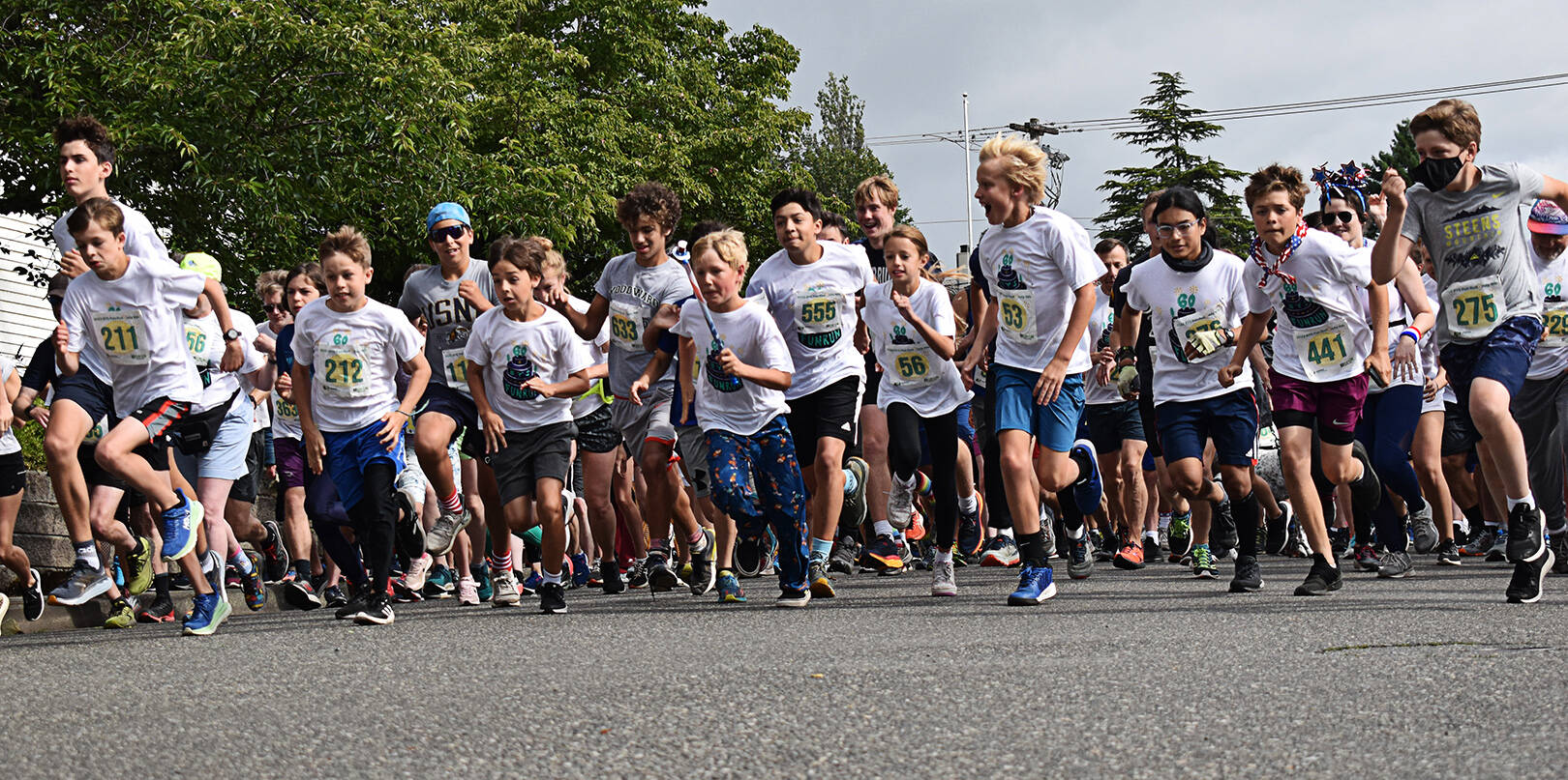 Children line up at the starting line for the packed 5K fun run on Bainbridge Island July 4.
