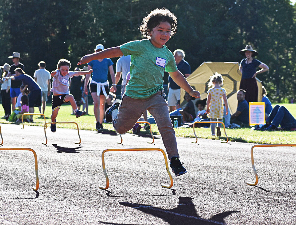 The kids compete by jumping over cute little hurdles.