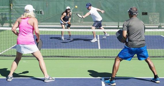 A foursome plays mixed doubles in pickleball. Courtesy Photo