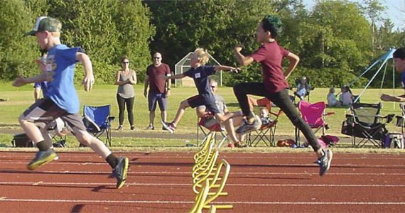 Boys compete in the hurdles in a recent All-Comer’s Track Meet. Bainbridge Kiwanis Courtesy Photos
