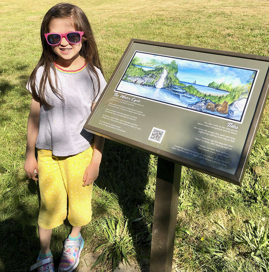 Courtesy Photo
Beatrice of Ordway Elementary on Bainbridge Island looks at one of the artist displays at the new BI Walkabout at Battle Point Park.