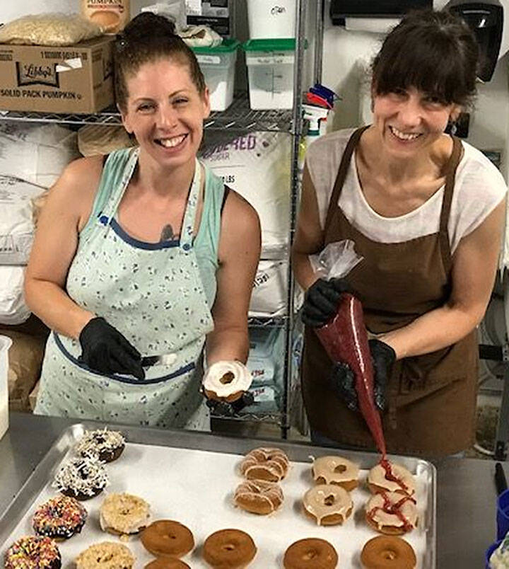 Mike De Felice/Bainbridge Island Review
Natalie Smith and Nina Zubal enjoy baking for Dude’s Donuts.