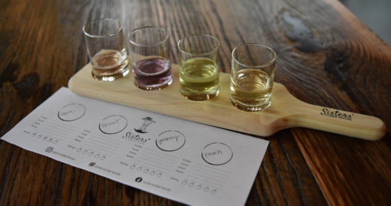 A colorful flight of cider offerings at Sisters’ Cider House.