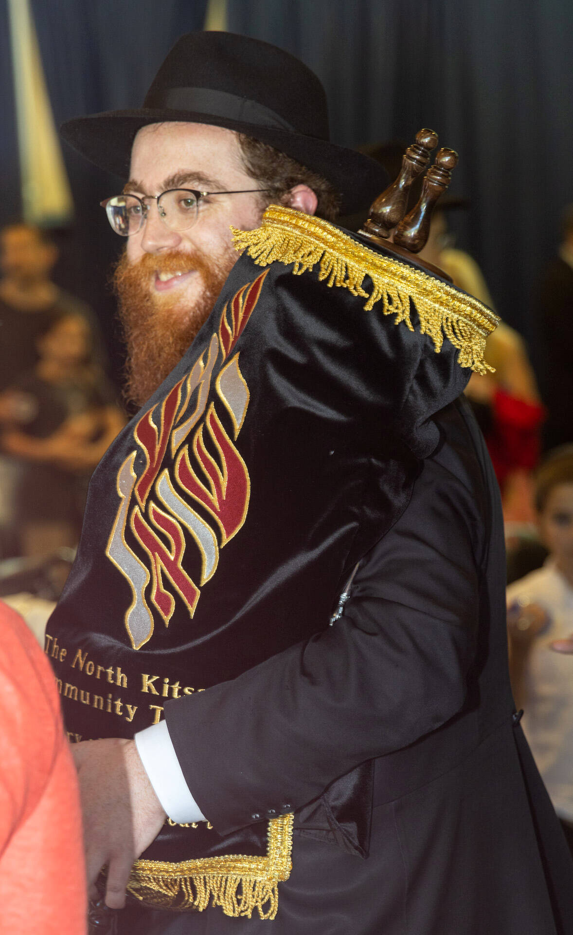 Rabbi Mendy Goldshmid carries the sacred Torah during the ceremony hosted by the Chabad Jewish Center of Bainbridge Island and North Kitsap.