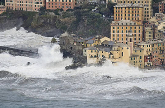 Tsunami waves hit a seaside town. Courtesy Photo